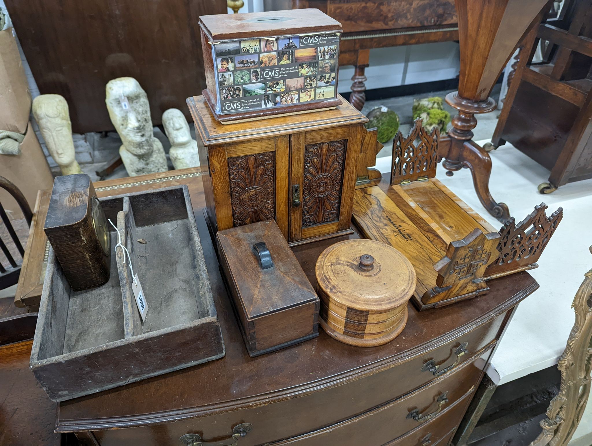A Victorian oak smoker's box, two olive wood book rests, money box, tray, clock and a cutlery box and another